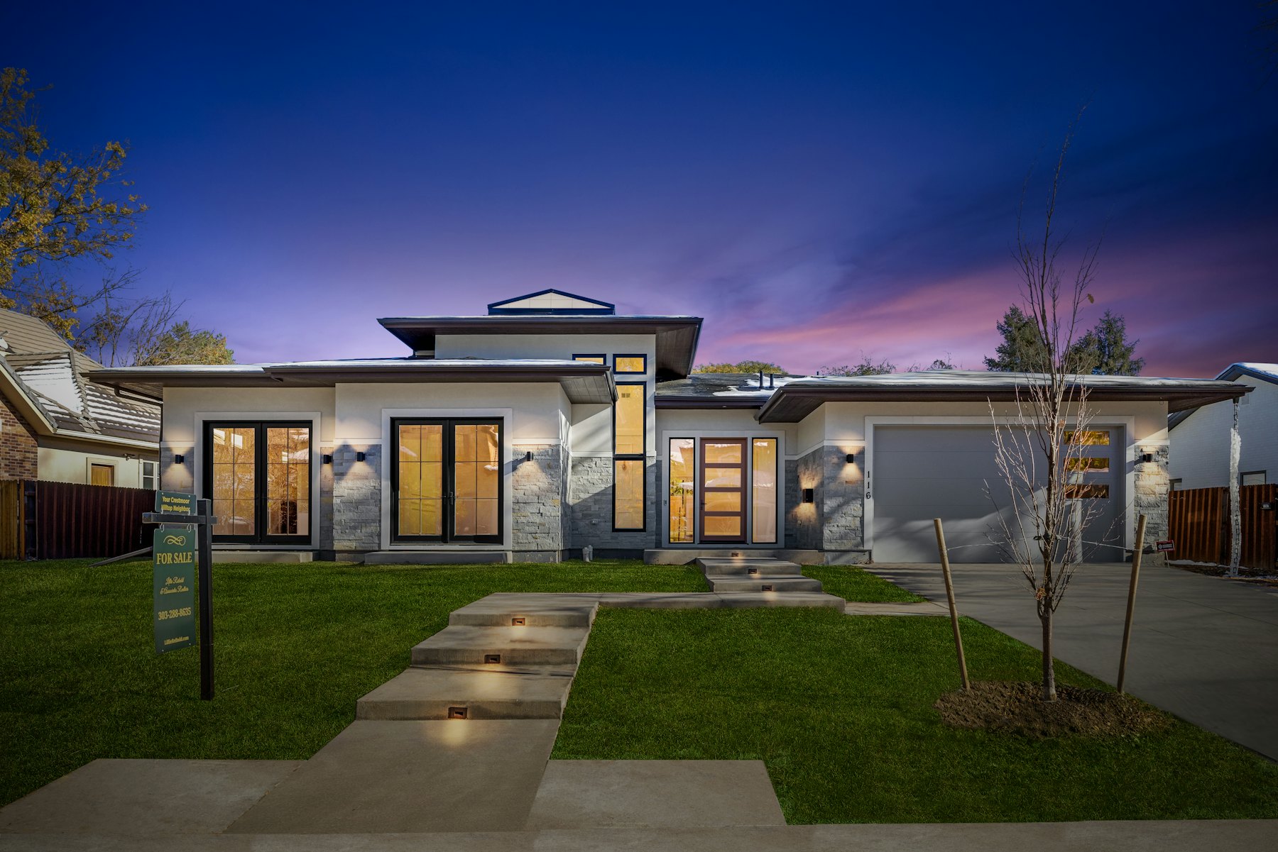 Modern home exterior with front yard